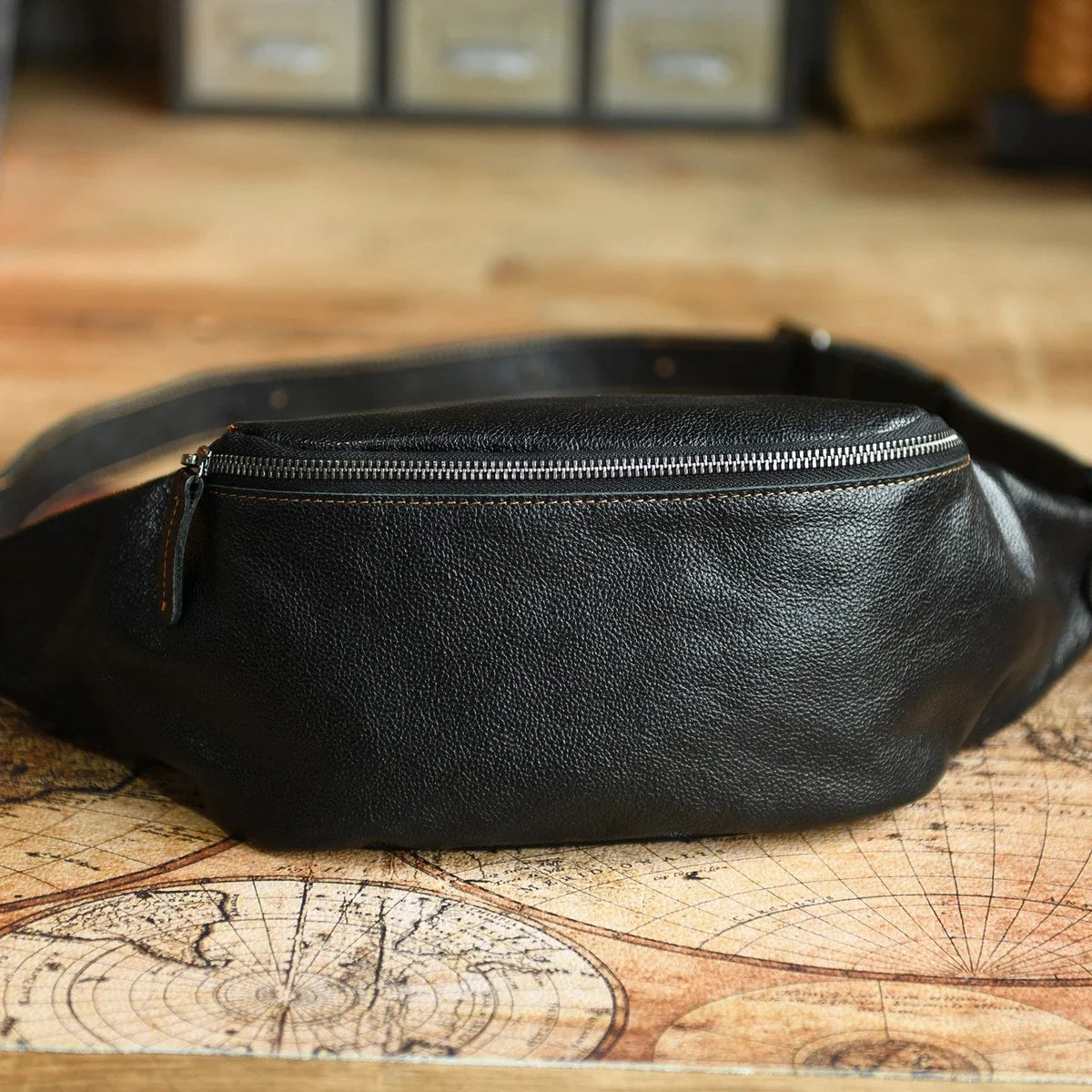 Black vegetable-tanned leather sling bag