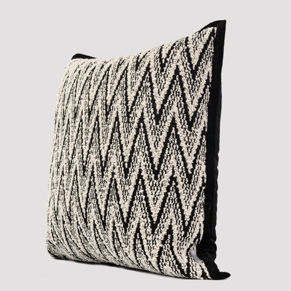 Black and white square herringbone cushion, side view