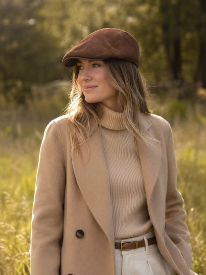 Woman wearing the Mocha Brown sheepskin leather newsboy cap with an autumn outfit
