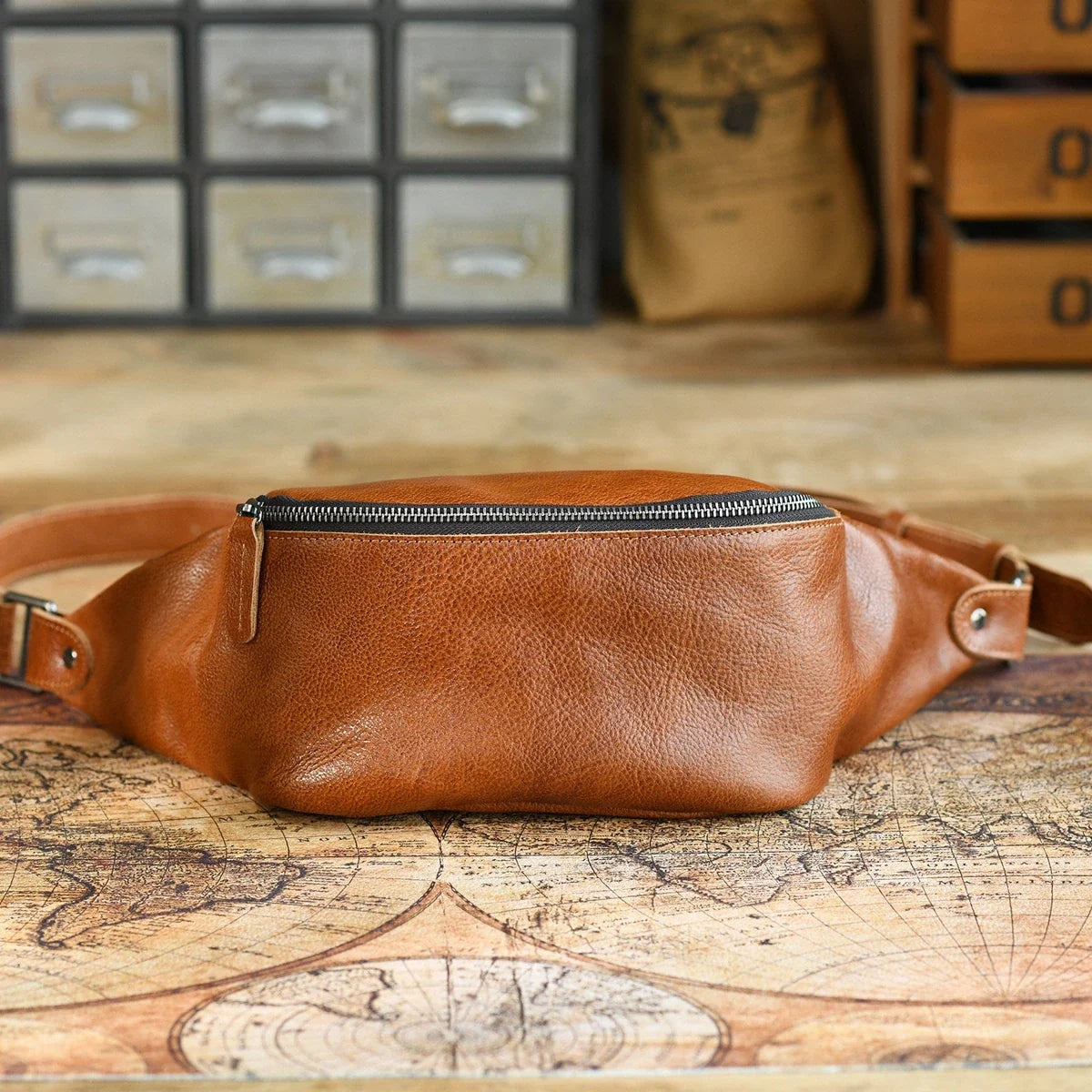 Brown vegetable-tanned leather sling bag