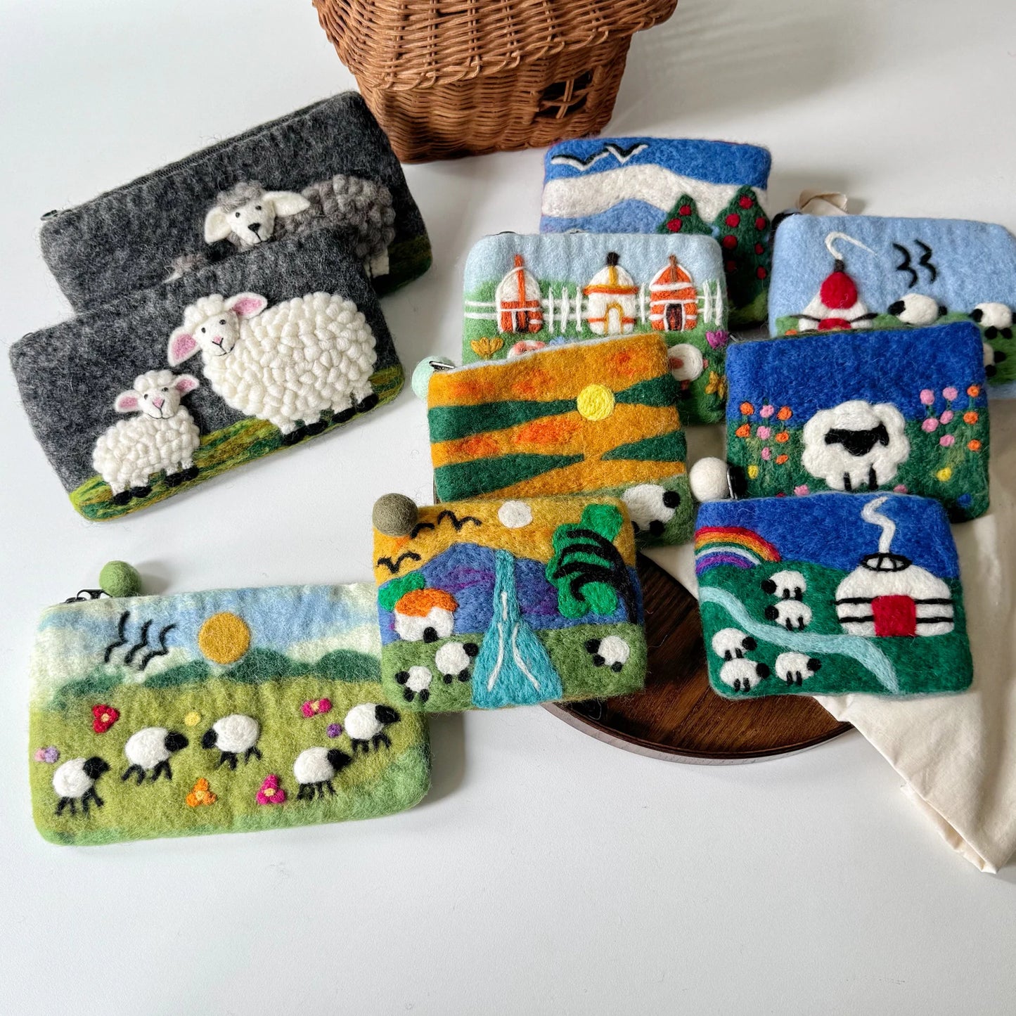 Handmade wool felt sheep coin purses arranged together