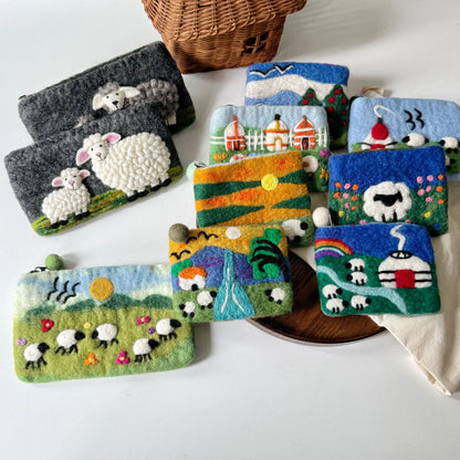 Handmade wool felt sheep coin purses arranged together