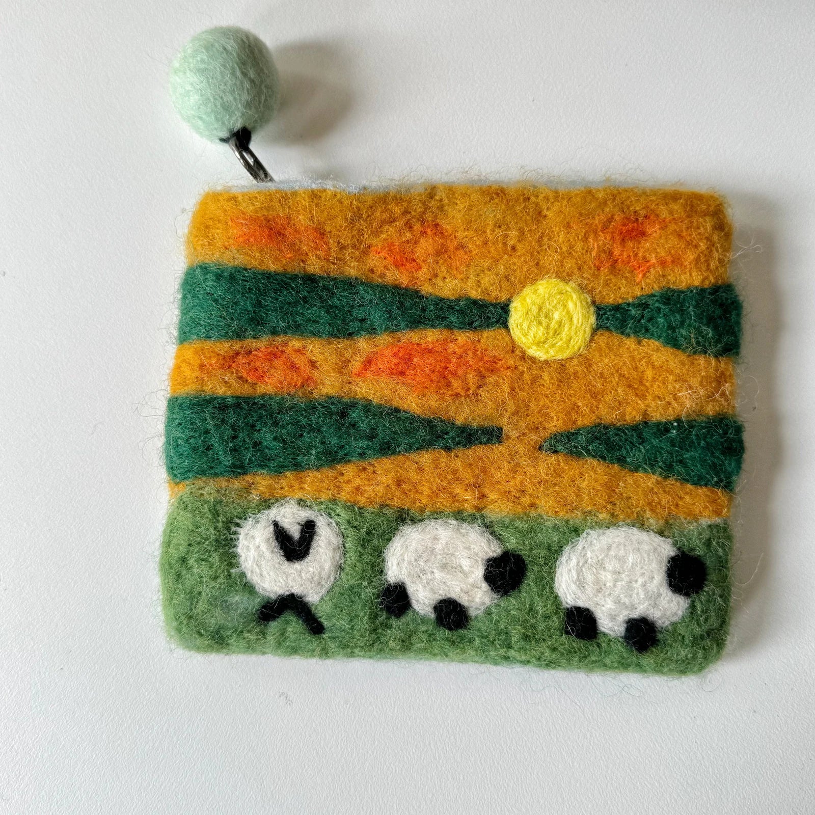 Handmade wool felt zip pouch — Sunset Sheep — 14 × 11 cm