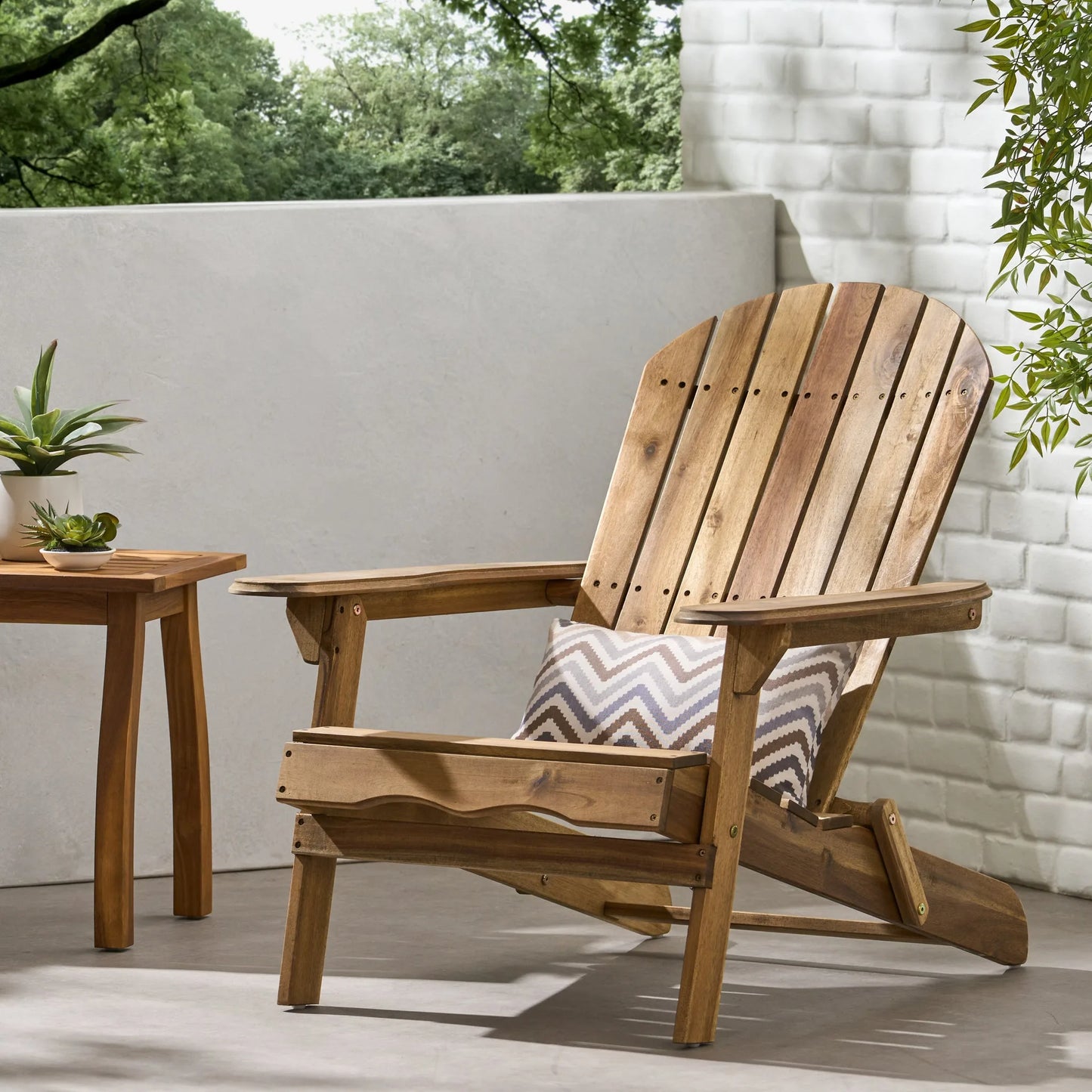 Folding Adirondack Chair Wooden Accent Furniture Lounge Chairs, Foldable Design for Patio & Garden Relaxation with Slatted Back & Wide Armrests- Teak Finish lifestyle view