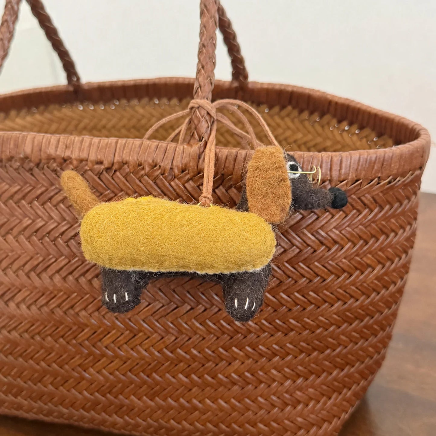Side view of handmade wool felt dachshund hanging ornament