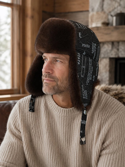 Man wearing the Dark Brown mink fur and sheepskin leather trapper hat at a cabin