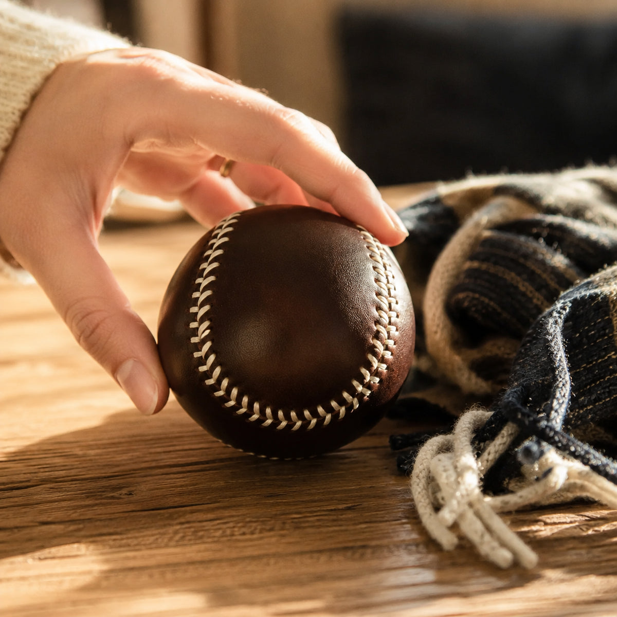 Dark coffee leather baseball styled with a textured knit scarf