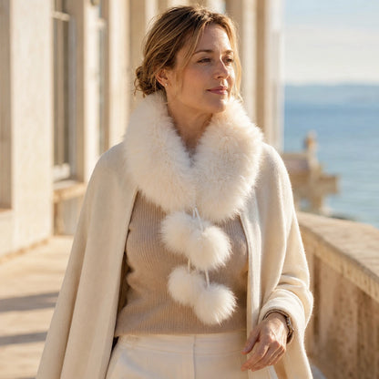 Ivory White genuine fox fur pom-pom scarf worn with winter coat