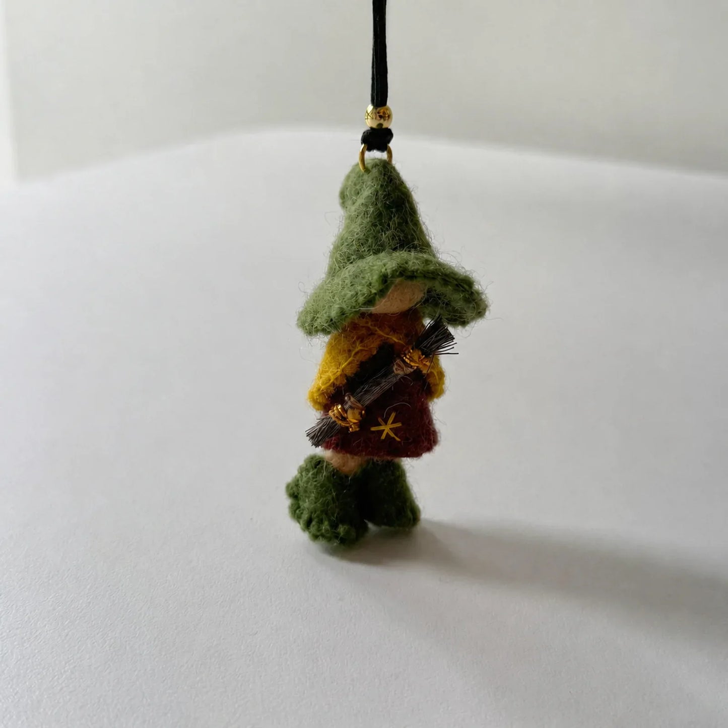Green wool felt witch ornament front detail