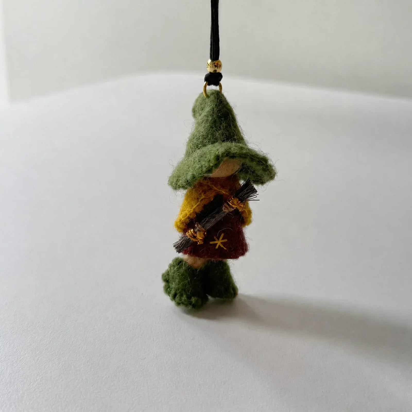 Green wool felt witch ornament front detail