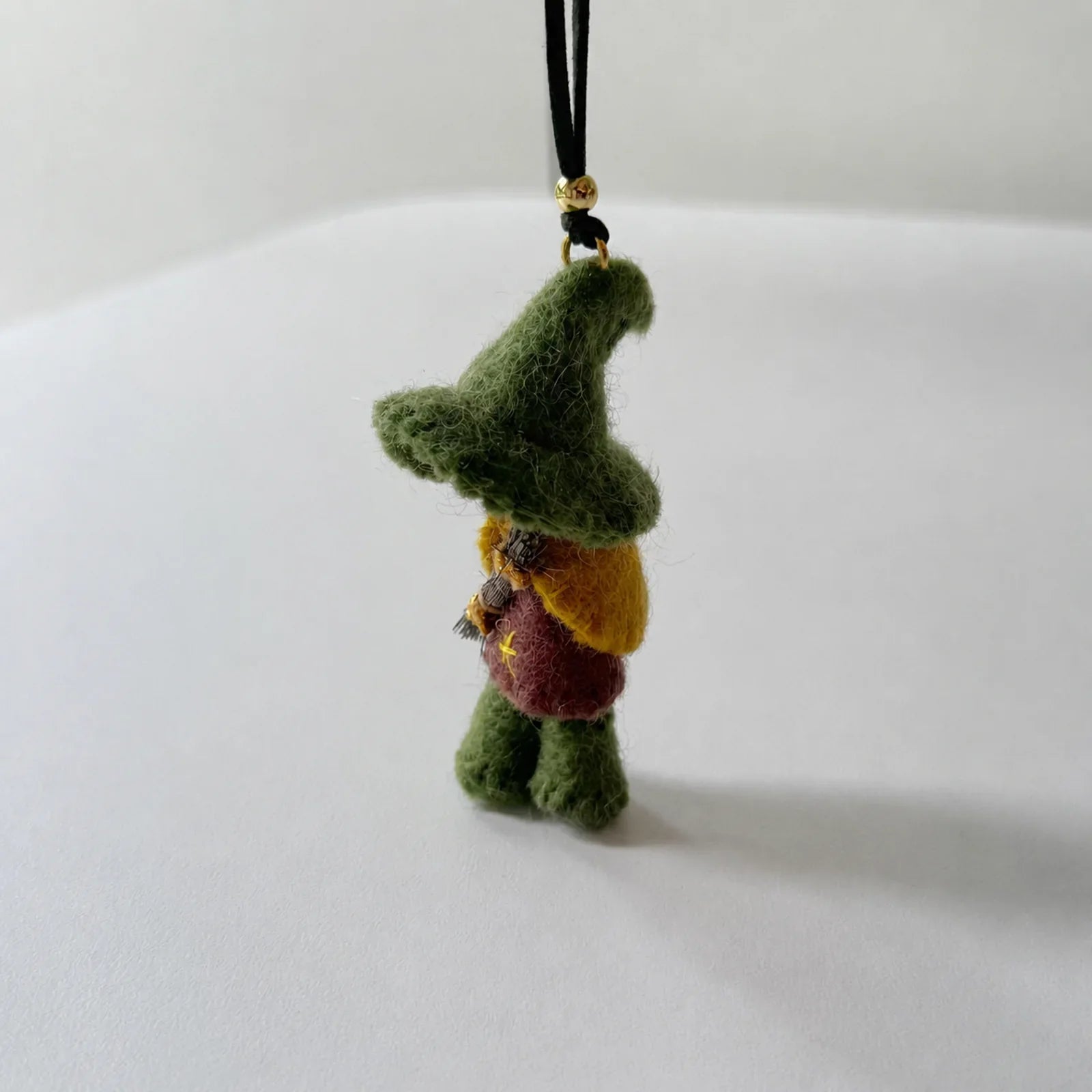 Green wool felt witch ornament side view