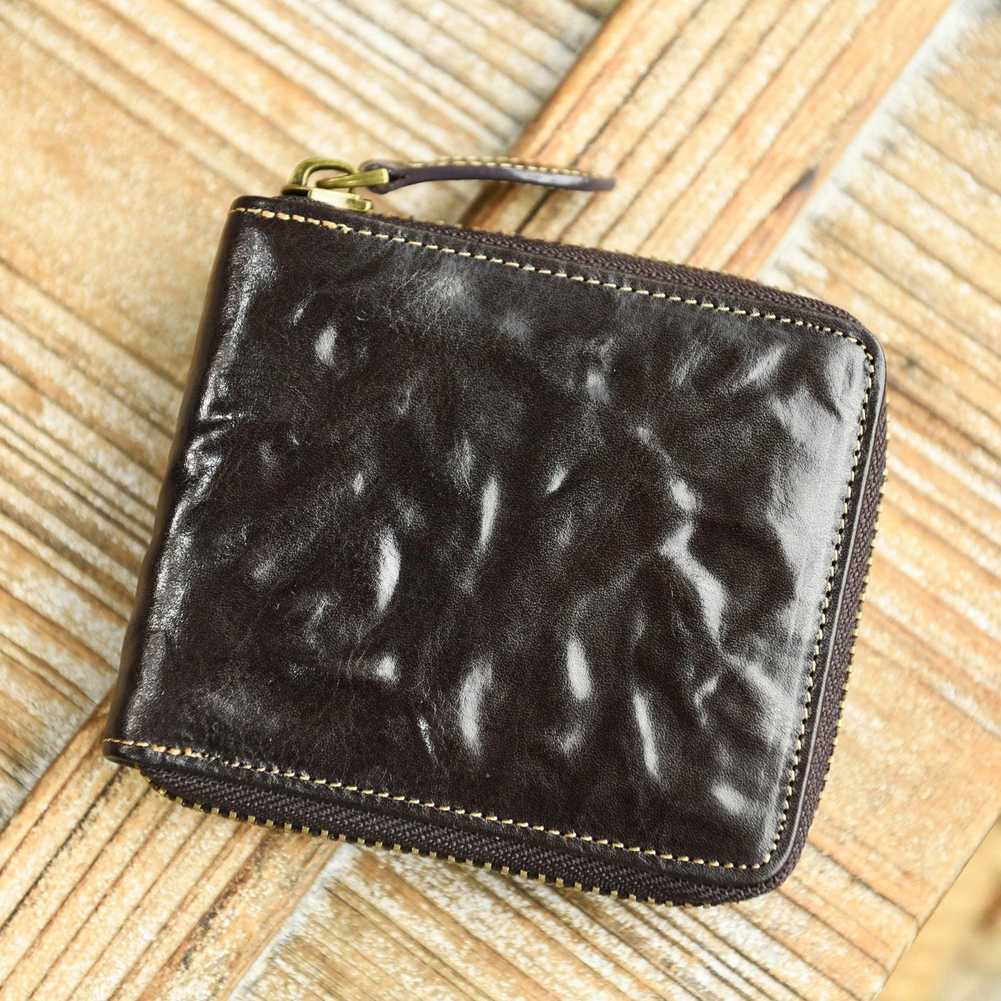 Dark Brown top-grain cowhide zip-around wallet with hand-creased texture