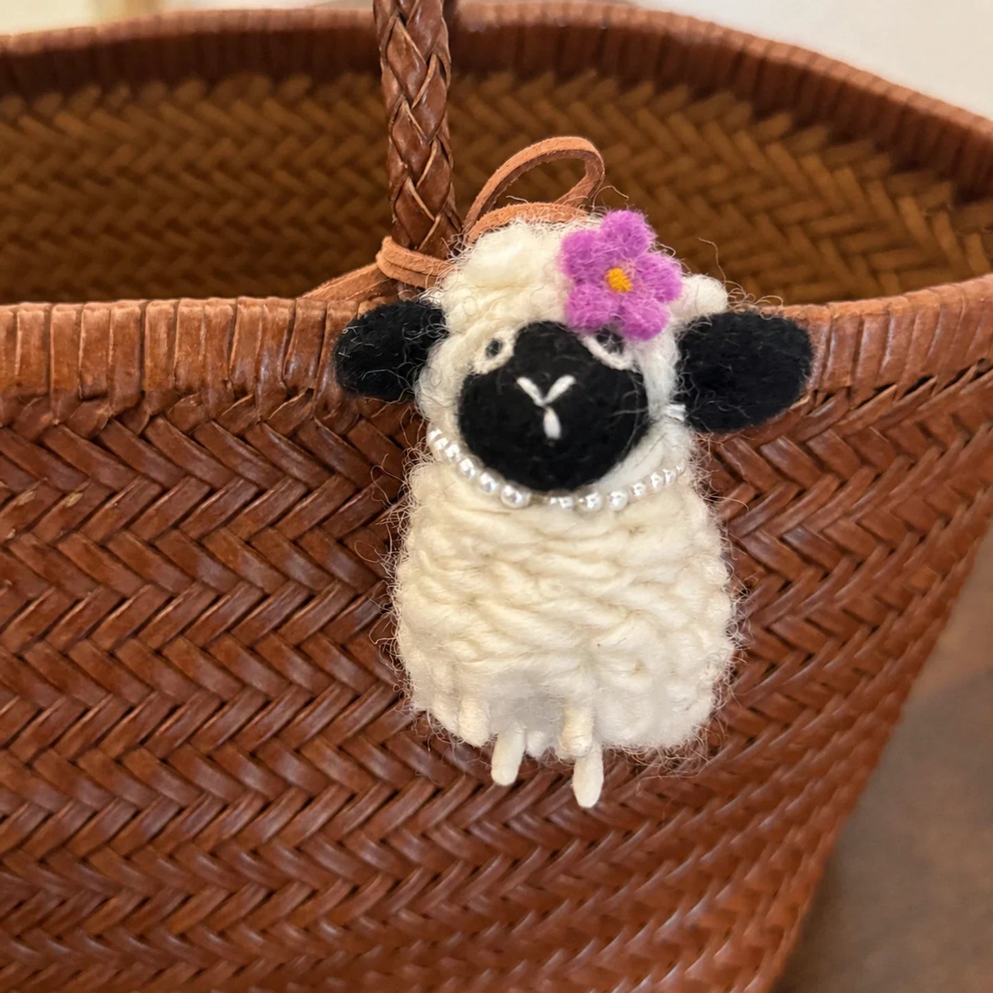 Wool felt sheep charm with black face purple flower and pearl necklace