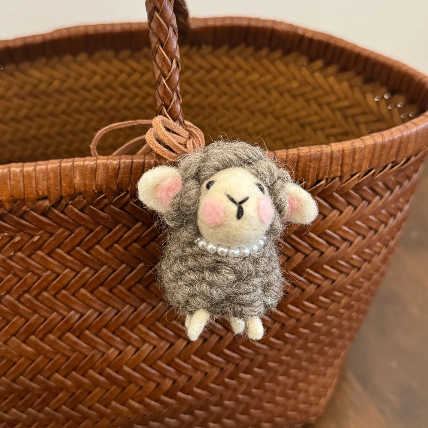 Gray wool felt sheep charm with blush cheeks and removable pearl necklace
