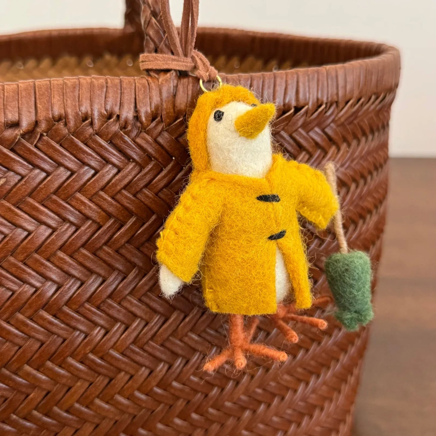 Handmade yellow wool felt chick ornament with textured details
