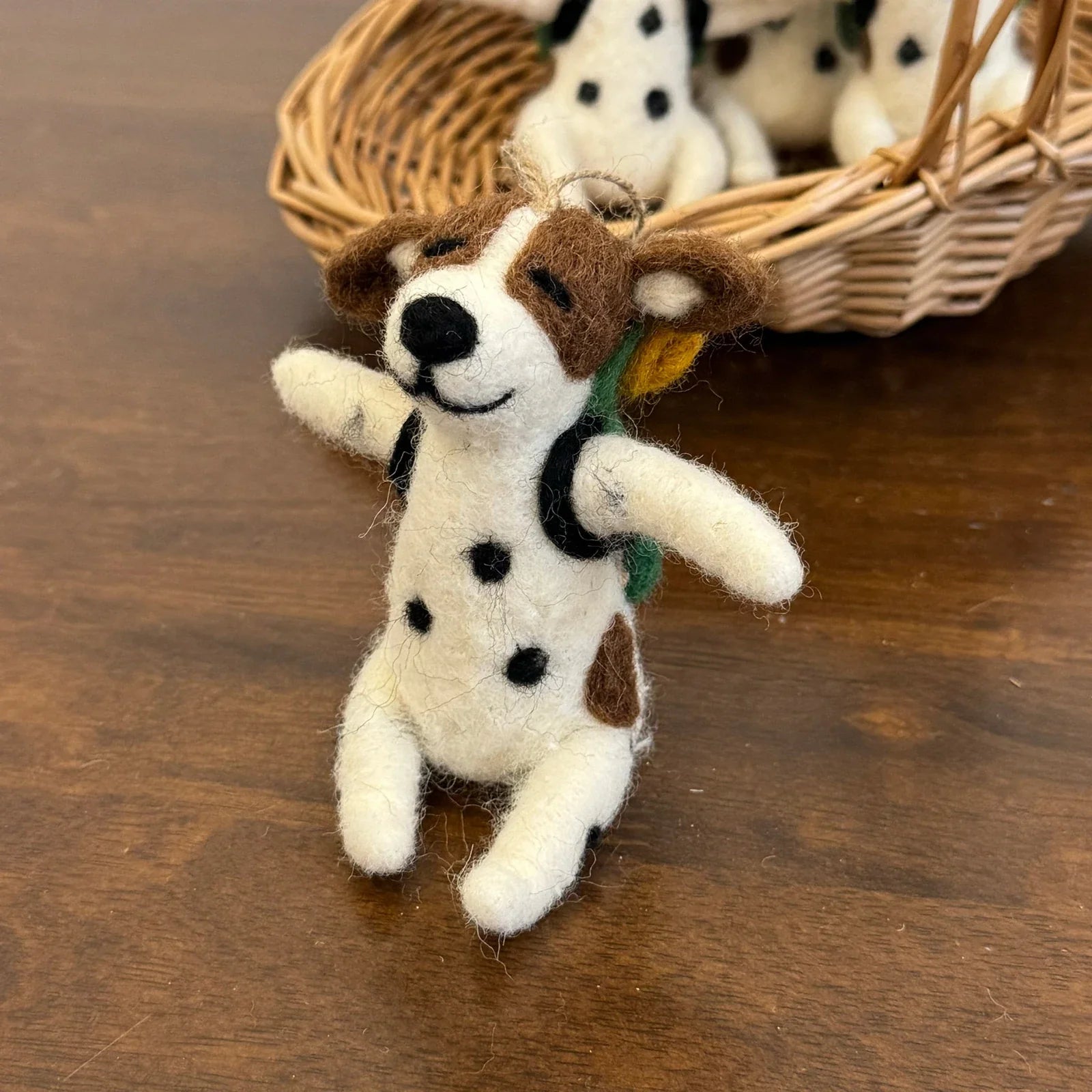 Front view of a handmade wool felt Dalmatian dog charm