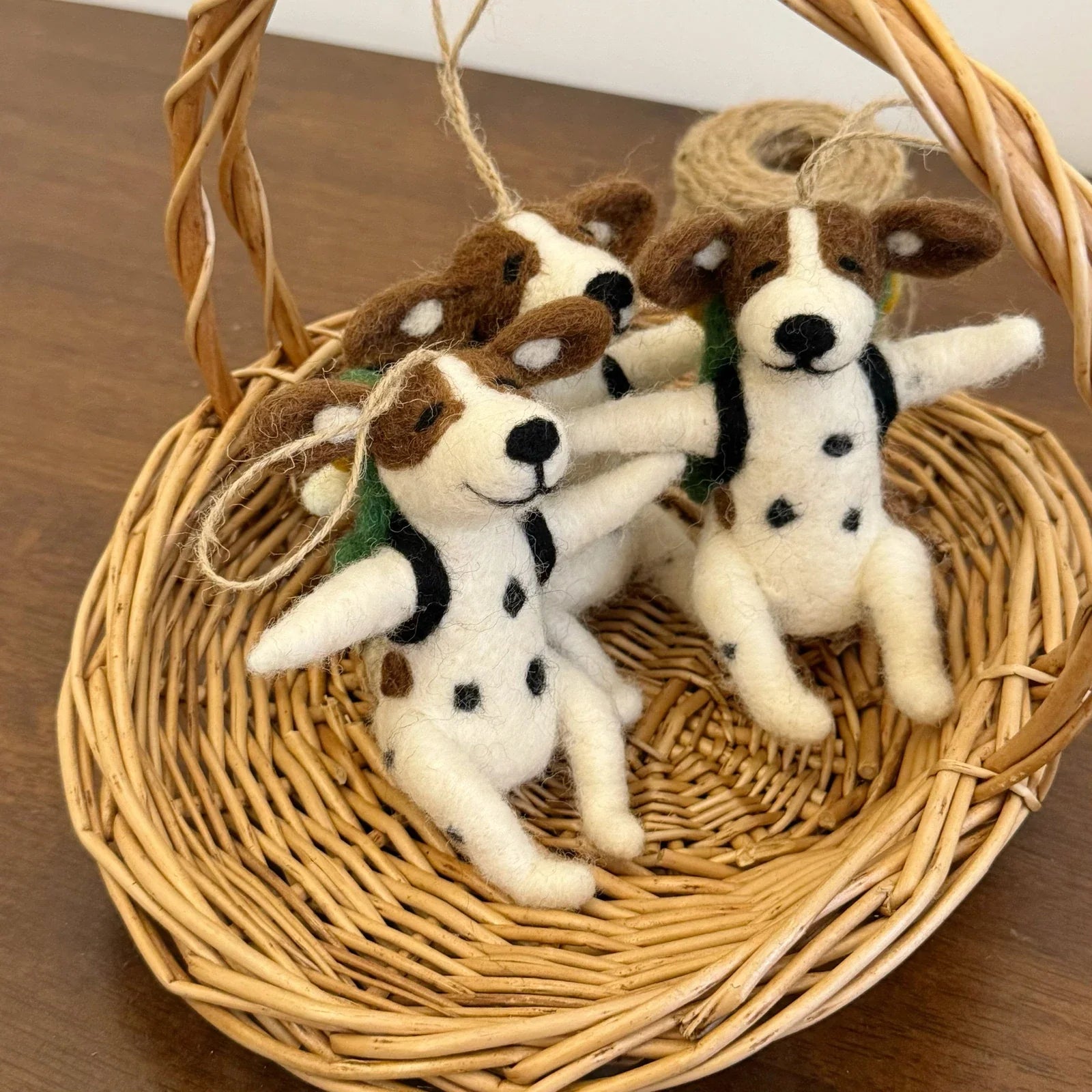 Pair of handmade wool felt Dalmatian charms in a woven basket