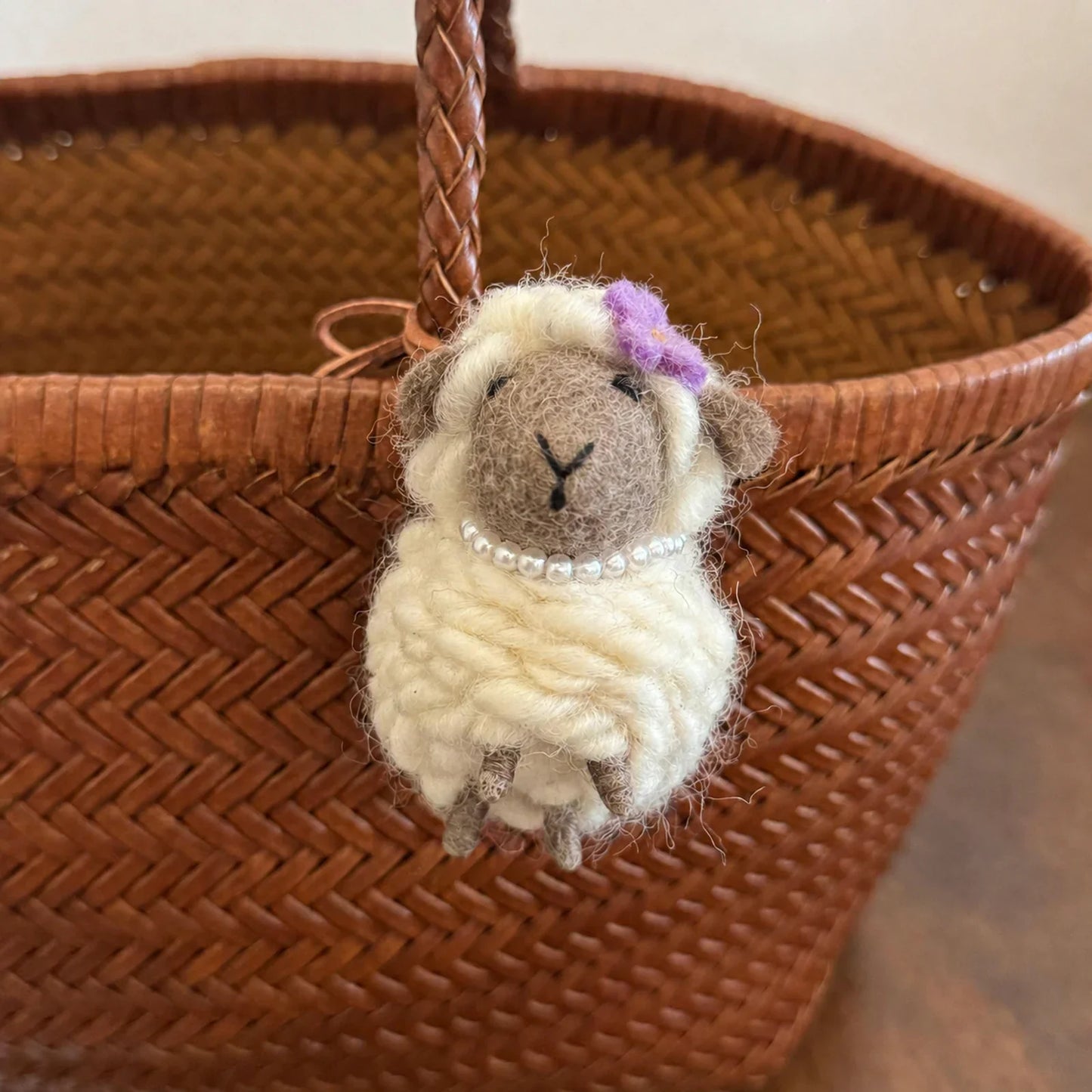 Wool felt sheep charm with gray face purple flower and pearl necklace