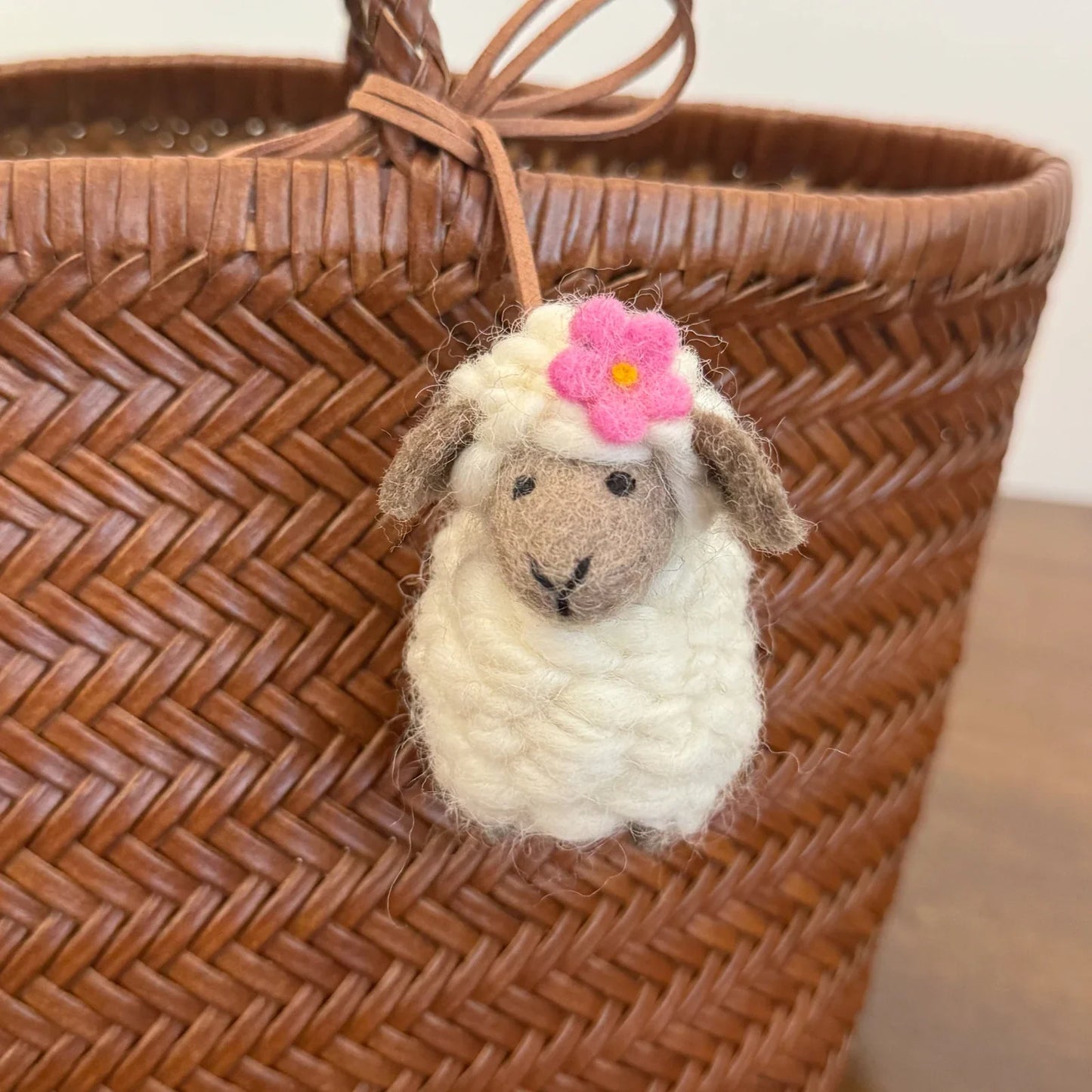 Wool felt sheep charm with gray face red flower detail