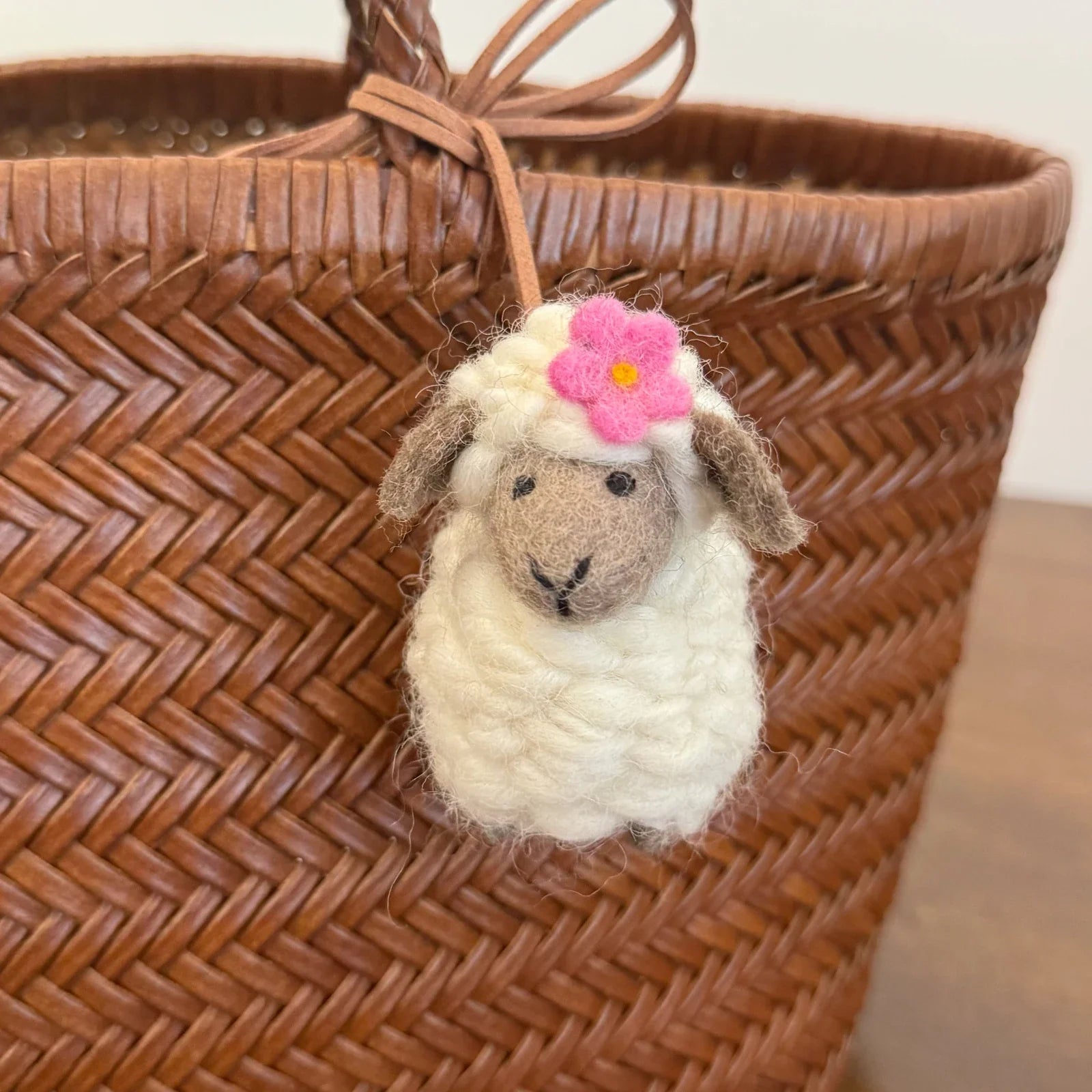 Wool felt sheep charm with gray face red flower detail