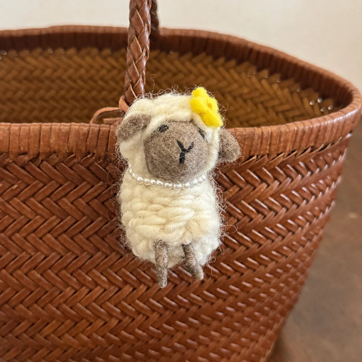 Wool felt sheep charm with gray face yellow flower and pearl necklace