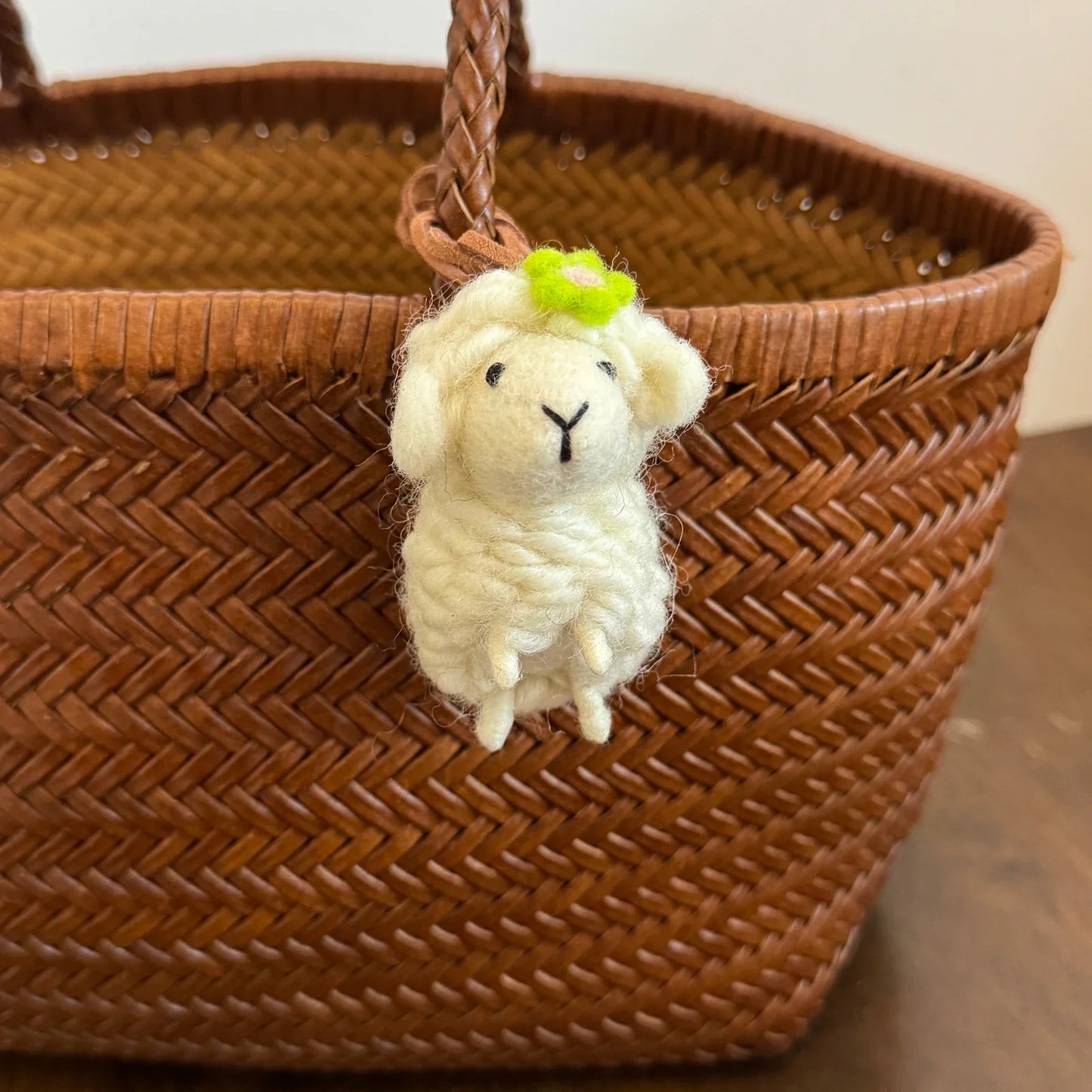 Cream wool felt sheep charm with green flower detail