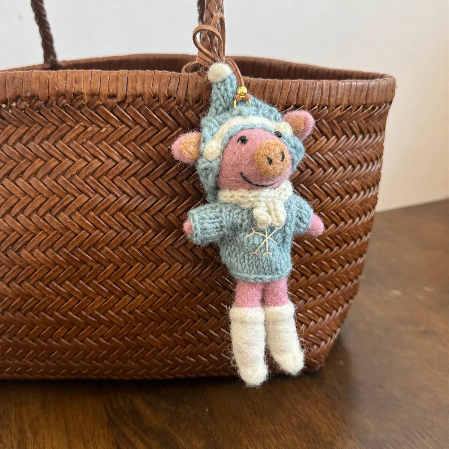 Handmade wool felt ski pig charm in blue knitwear