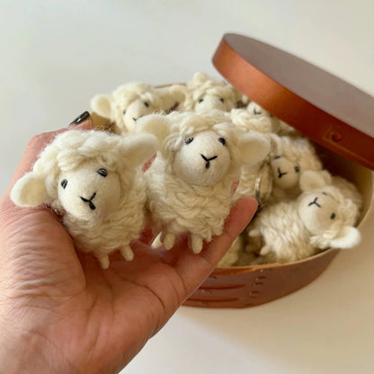 Handheld group of soft wool felt sheep charms