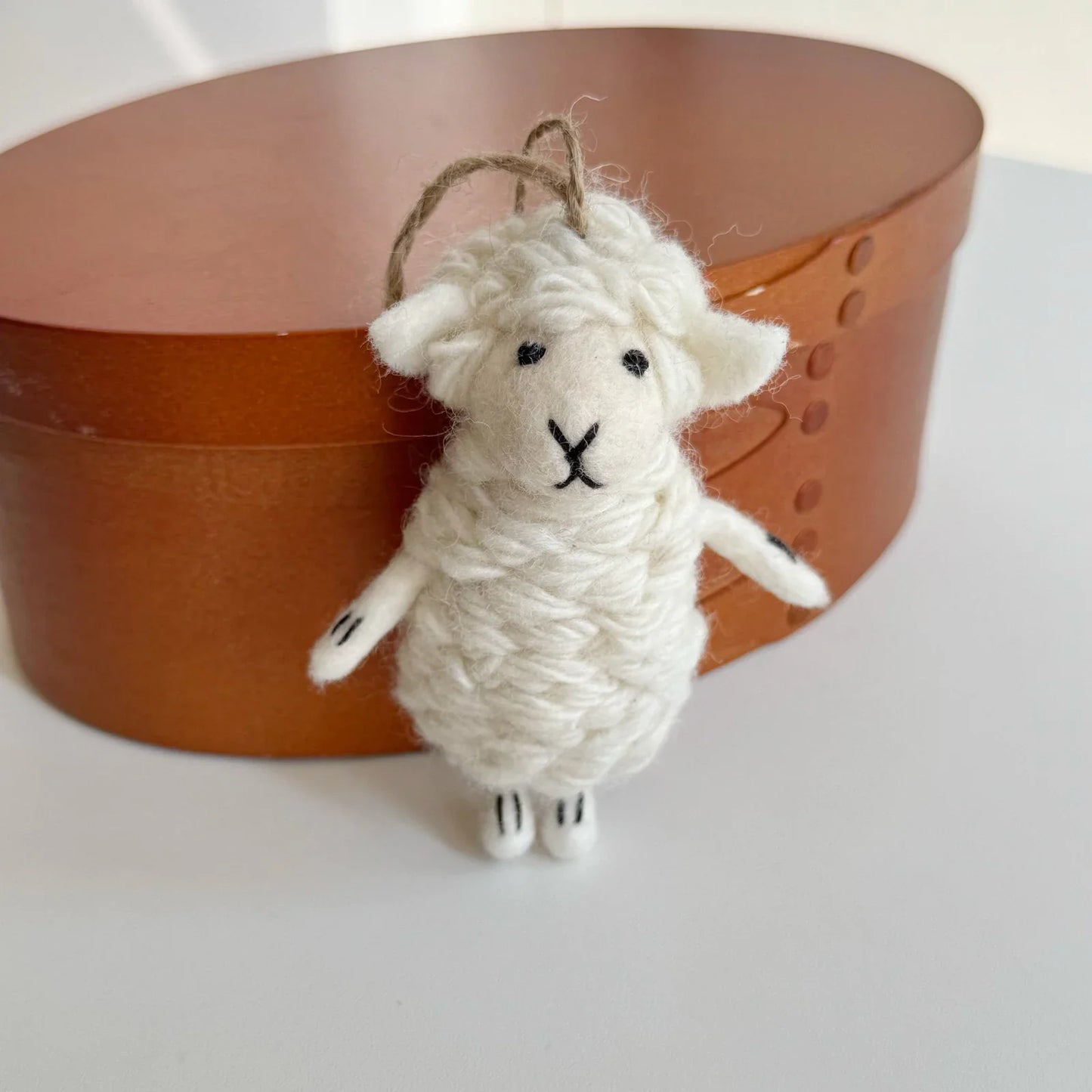 Single cream wool felt sheep charm with leather cord loop