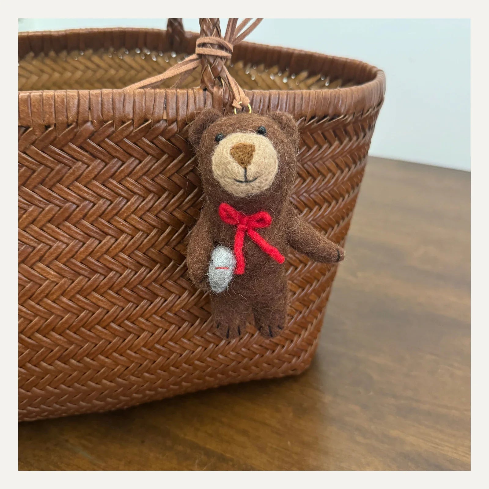 Handmade vintage brown wool felt bear bag charm with red bow and leather cord