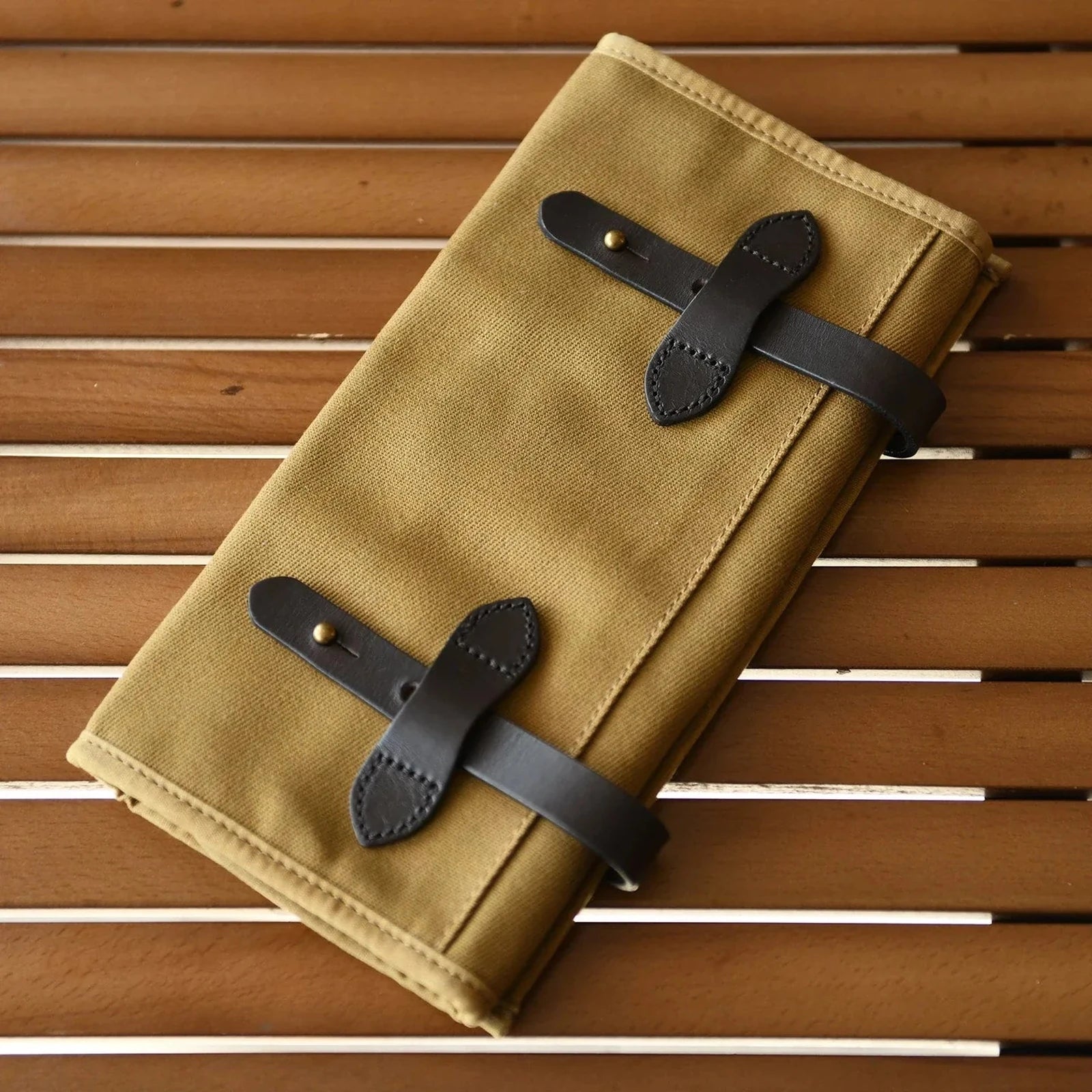 Khaki waxed canvas and cowhide roll-up tool organizer