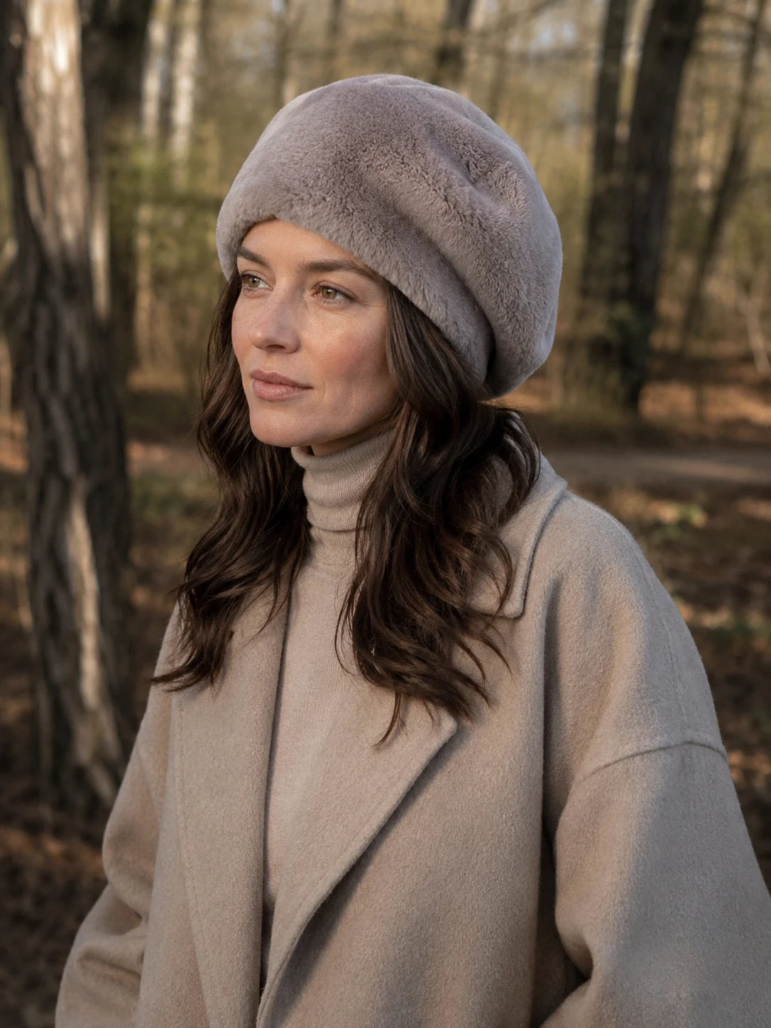 Woman wearing the Mauve Gray genuine Rex rabbit fur beret in a woodland setting
