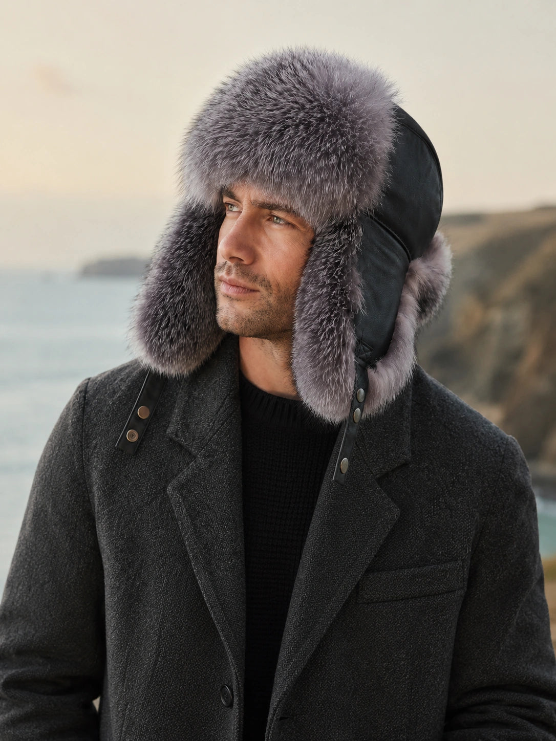 Man wearing a Silver Gray Fox fur trapper hat on a winter coast