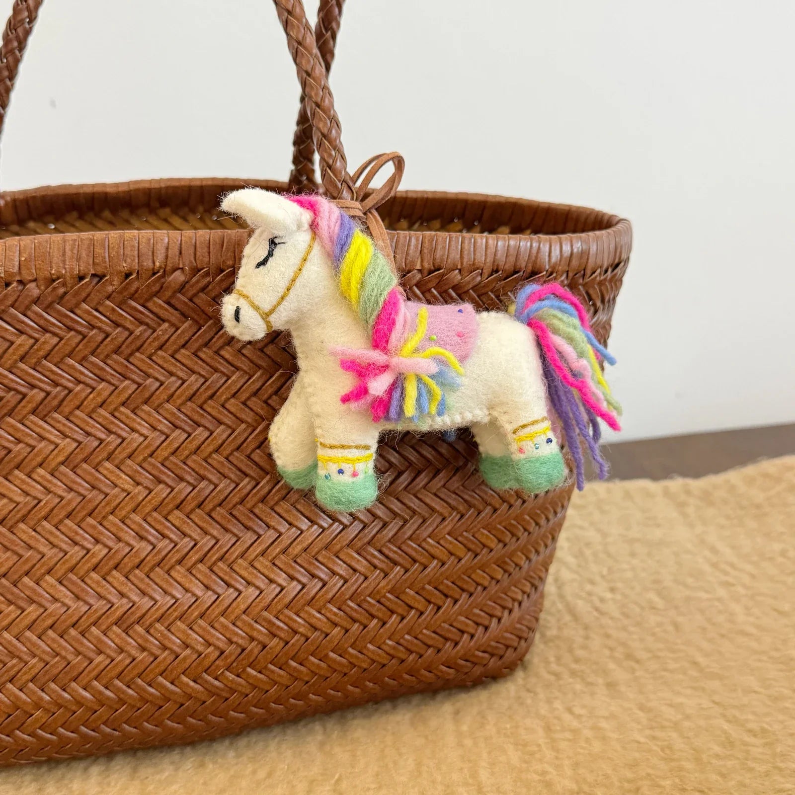 Handmade details of the multicolor wool felt horse bag charm