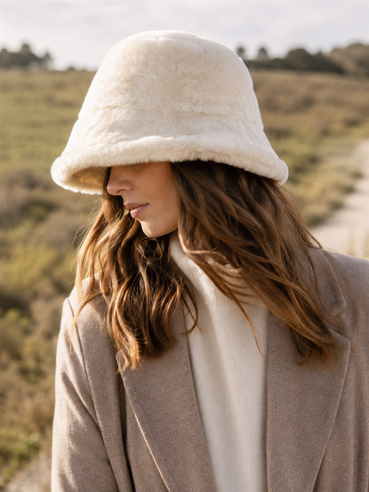 Person wearing an Off-White genuine leather short-brim bucket hat outdoors