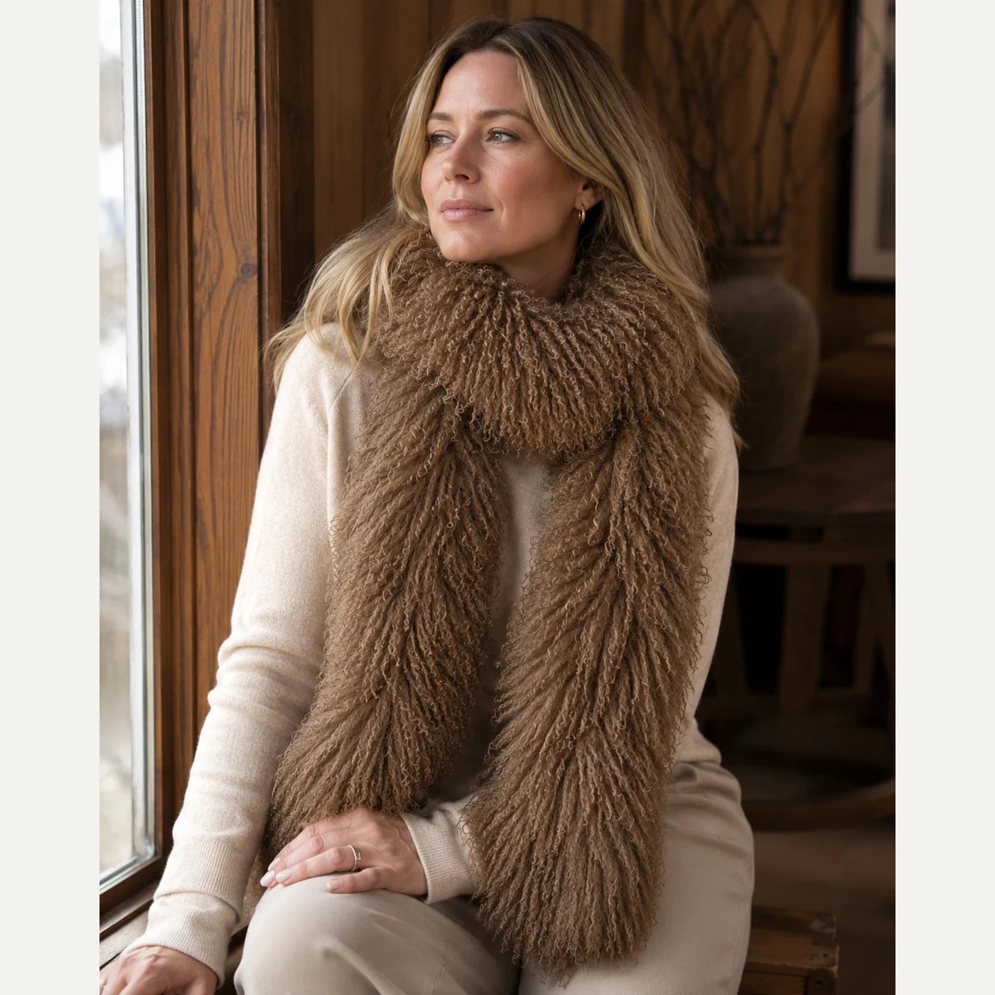 Capricornus Living Caramel genuine curly lamb fur long scarf worn with neutral knitwear