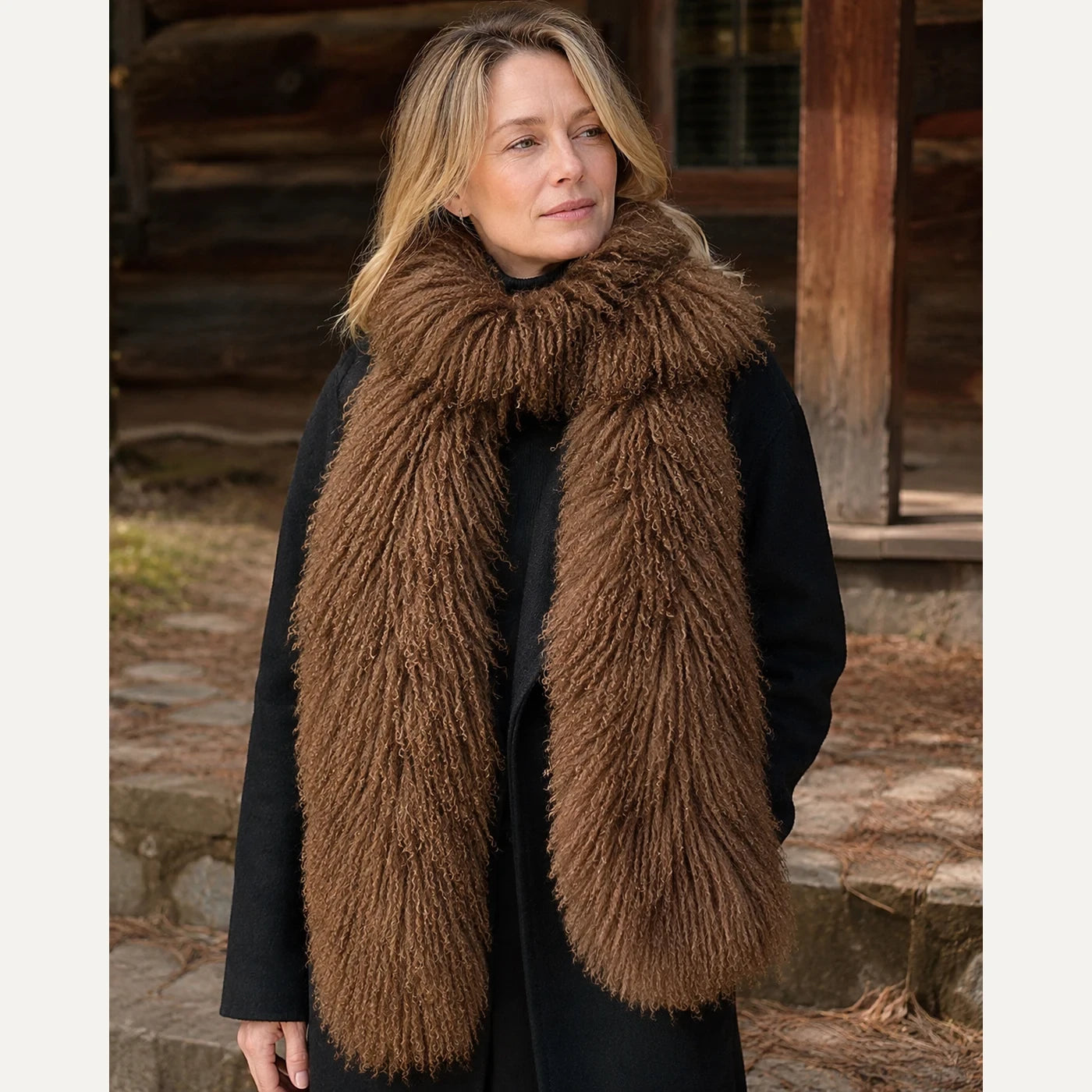 Capricornus Living Caramel genuine curly lamb fur long scarf worn outdoors with a black coat