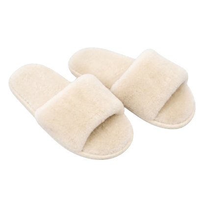 Capricornus Living Ivory White genuine Australian shearling slide slippers on a transparent background