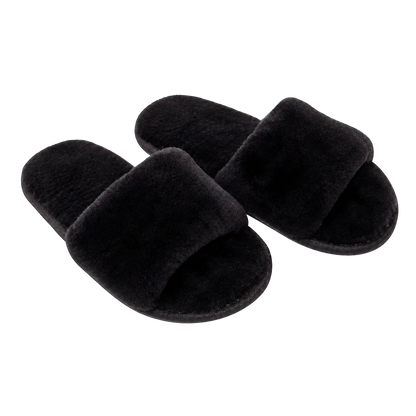 Capricornus Living Natural Black genuine Australian shearling slide slippers on a transparent background