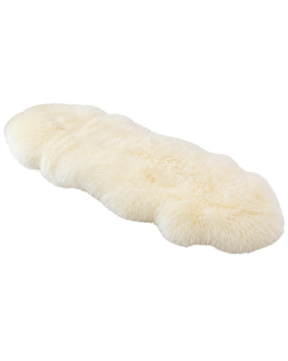 Capricornus Living Cream Beige genuine sheepskin sofa runner on a transparent background
