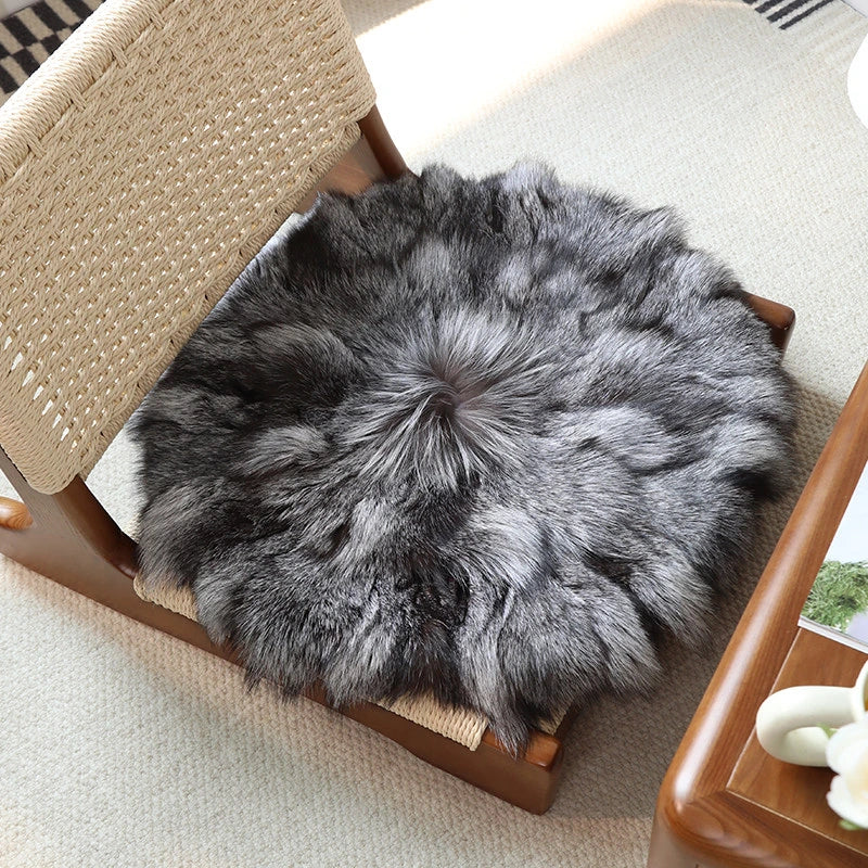 Capricornus Living Silver Fox genuine natural fur cushion fitted to a wood dining chair