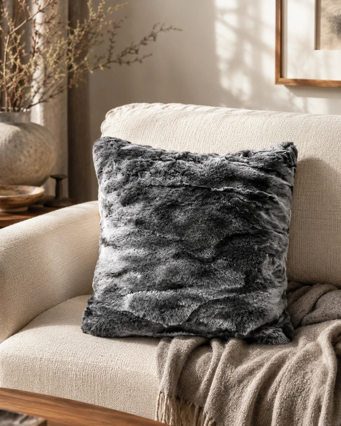 Capricornus Living Moonlit Gray rabbit fur throw pillow on a quiet chair