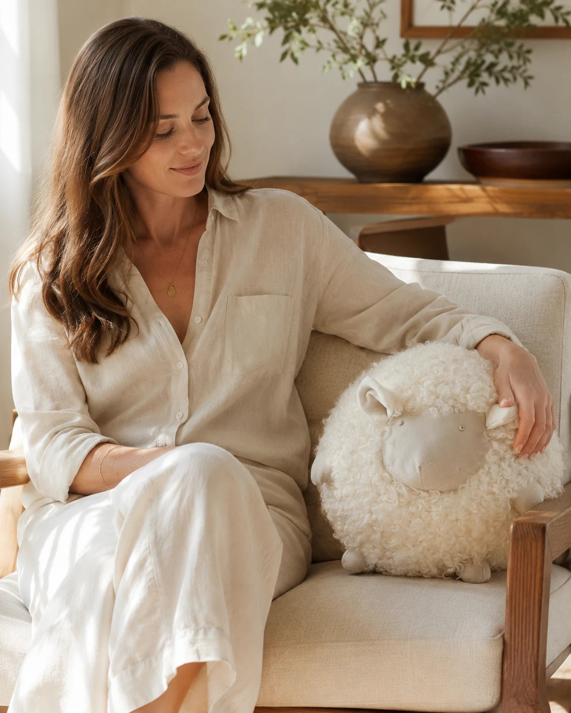 Capricornus Living Cream White sheep pillow used on a neutral sofa