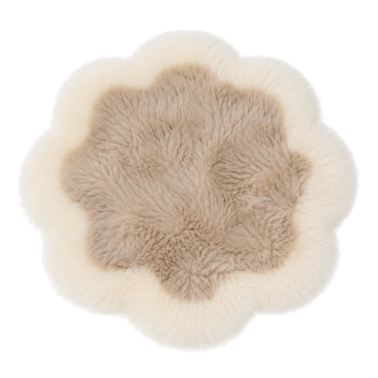 Capricornus Living Ivory Border and Taupe Center genuine sheepskin flower chair pad on a transparent background