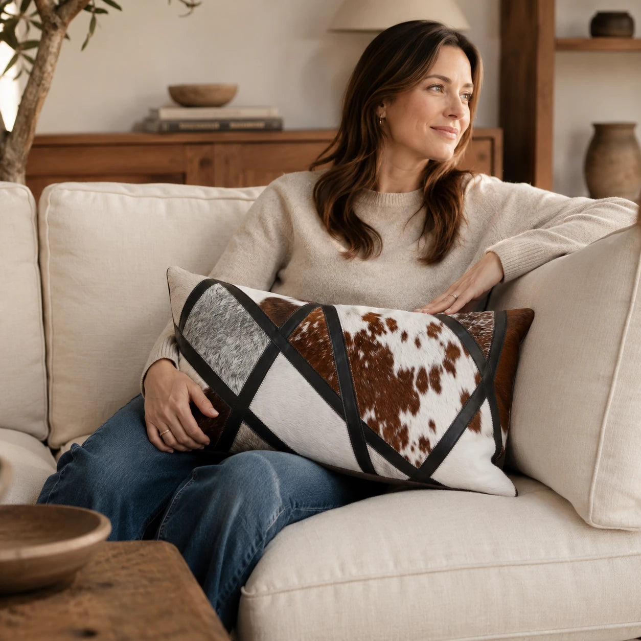 Capricornus Living Coffee and Ivory lumbar cowhide pillow used for sofa support