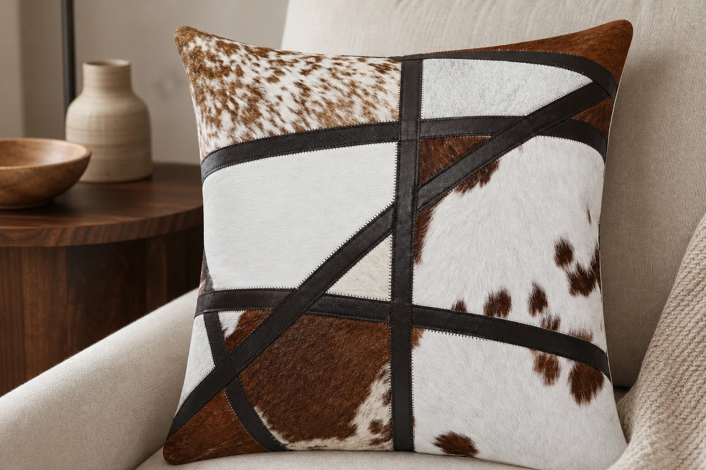 Capricornus Living Close detail of natural cowhide texture leather appliqué and stitching