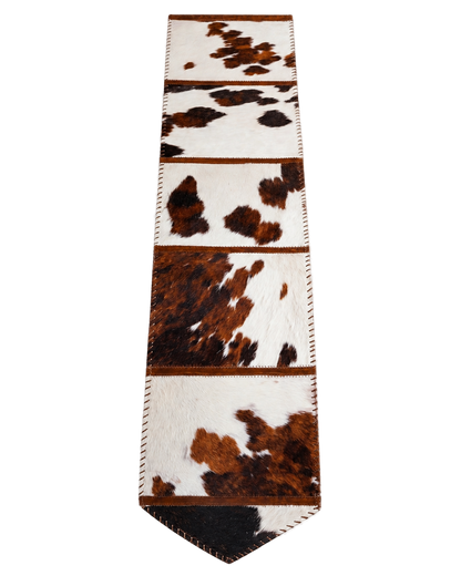 Capricornus Living Random Tricolor genuine hair-on cowhide table runner on a transparent background