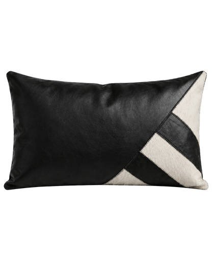 Architectural black leather and ivory cowhide geometric lumbar pillow on transparent background
