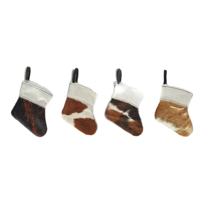 Capricornus Living Four-piece genuine hair-on cowhide mini holiday stocking ornament set on a transparent background