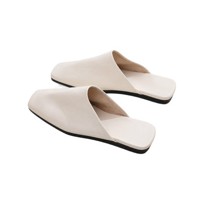 Capricornus Living Ivory closed-toe genuine leather house slippers on a transparent background